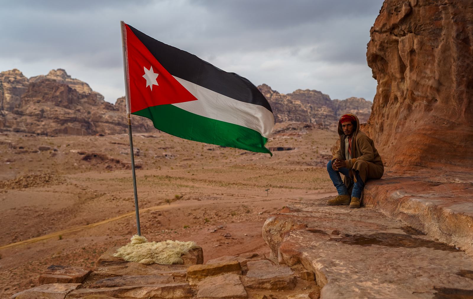 Jason by the Jordanian flag above Petra